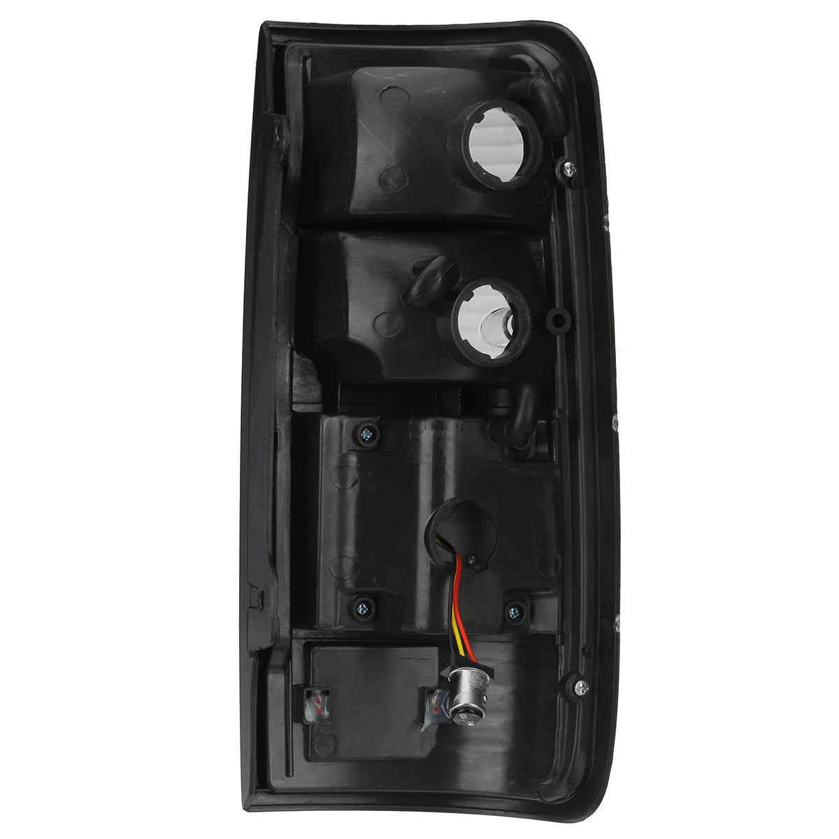The backside view of a black, rectangular vehicle taillight assembly, showing the mounting points and bulb sockets. There are two large circular openings for bulb access at the top and one smaller opening lower down, with a wiring harness connected to a smaller bulb socket visible at the bottom. The assembly has mounting screws visible on the black plastic housing.