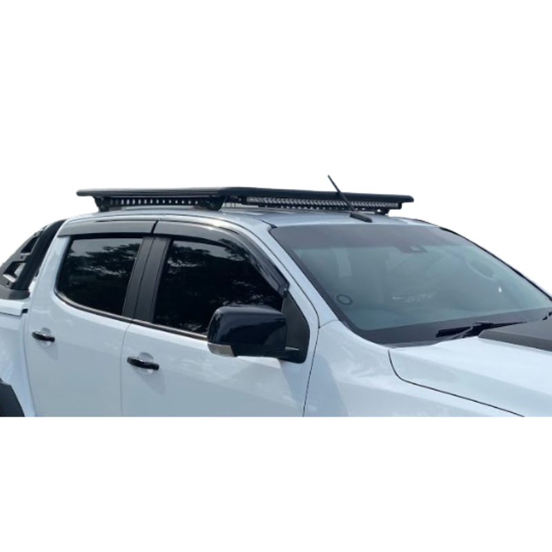 A white double-cab pickup truck (likely a Mitsubishi Triton/L200) shown from a front-three-quarter angle against a white background. The truck is fitted with several aftermarket accessories, including a black bonnet protector (bug shield) over the hood, a black grille, aggressive all-terrain tires on black steel wheels, and polished silver side steps/running boards.