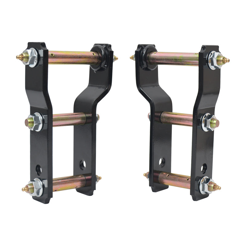 A pair of black heavy-duty shackle hangers for vehicle suspension, standing upright. Each hanger features thick black metal plates connected by three gold-colored bolts and bushings. The bolts are secured with silver nuts on the outer side of the plates. These components are used to lift or adjust the rear suspension, particularly on trucks or SUVs.