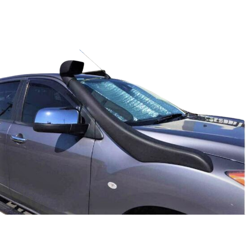 A close-up view of the front passenger side of a grey pickup truck, likely a Mazda BT-50 or Ford Ranger, demonstrating an installed black plastic snorkel. The snorkel runs along the fender and up the A-pillar, with the square air ram head positioned above the roofline. The vehicle has chrome side mirrors and a silver sun shade visible in the windshield. The truck is pictured against a plain white background.