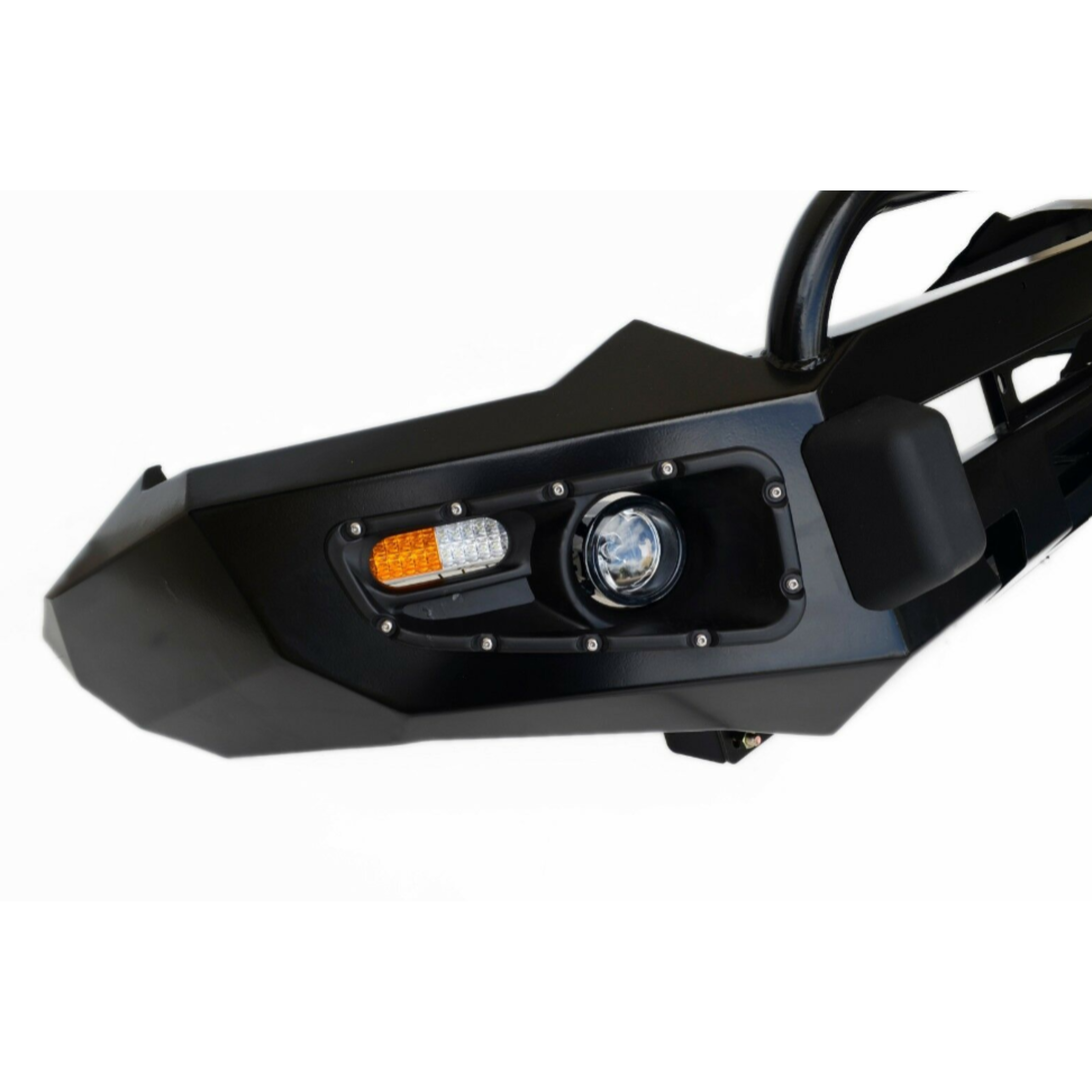 A close-up shot of the corner of a black, heavy-duty aftermarket steel bumper for a 4x4 vehicle, isolated on a white background. The textured, angular bumper features an integrated light housing with a circular projector fog light and an adjacent rectangular light unit containing an amber turn signal and white daytime running lights or park lights.